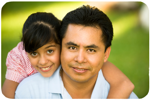 hispanic father with his daughter giving him a hug