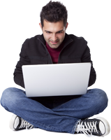 Guy sitting on the ground using his laptop