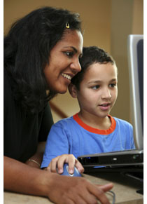 mom and son using computer